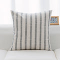 Neutral tones pillows in classic check and stripe pattern