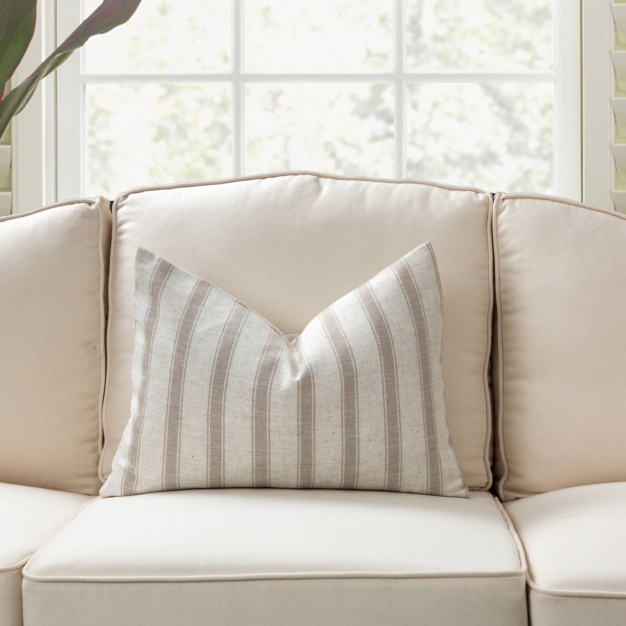 Neutral tones pillows in classic check and stripe pattern