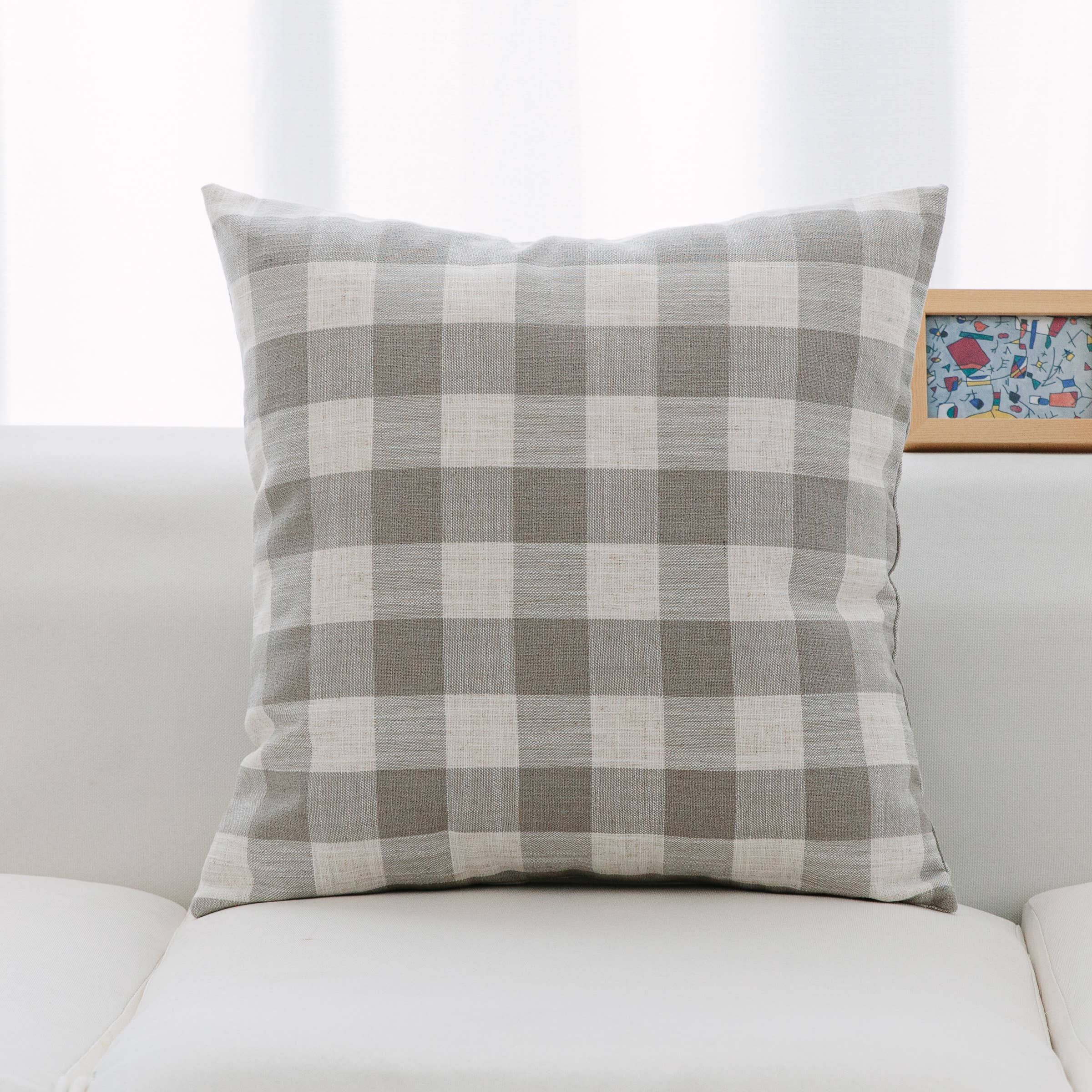 Neutral tones pillows in classic check and stripe pattern